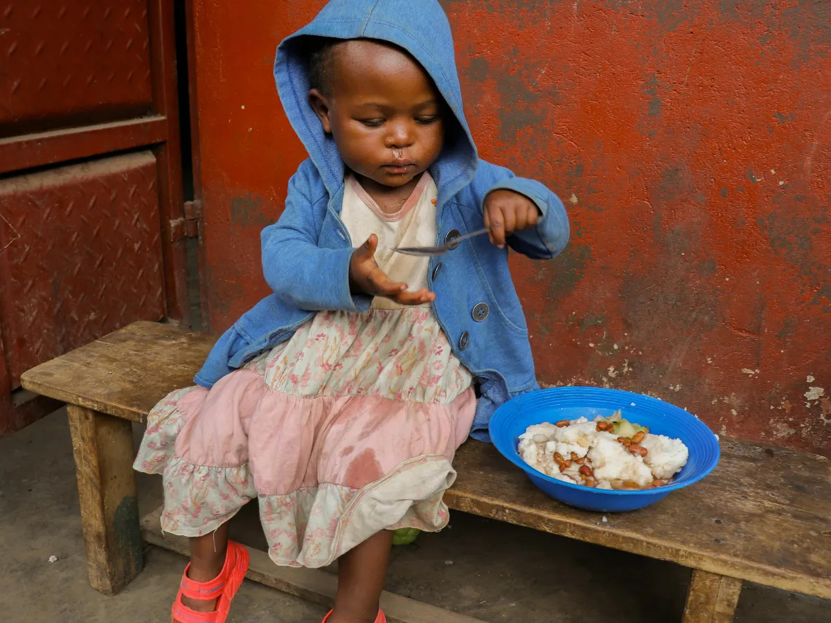 Child receiving food support through Noms Drive food parcel drive South Africa