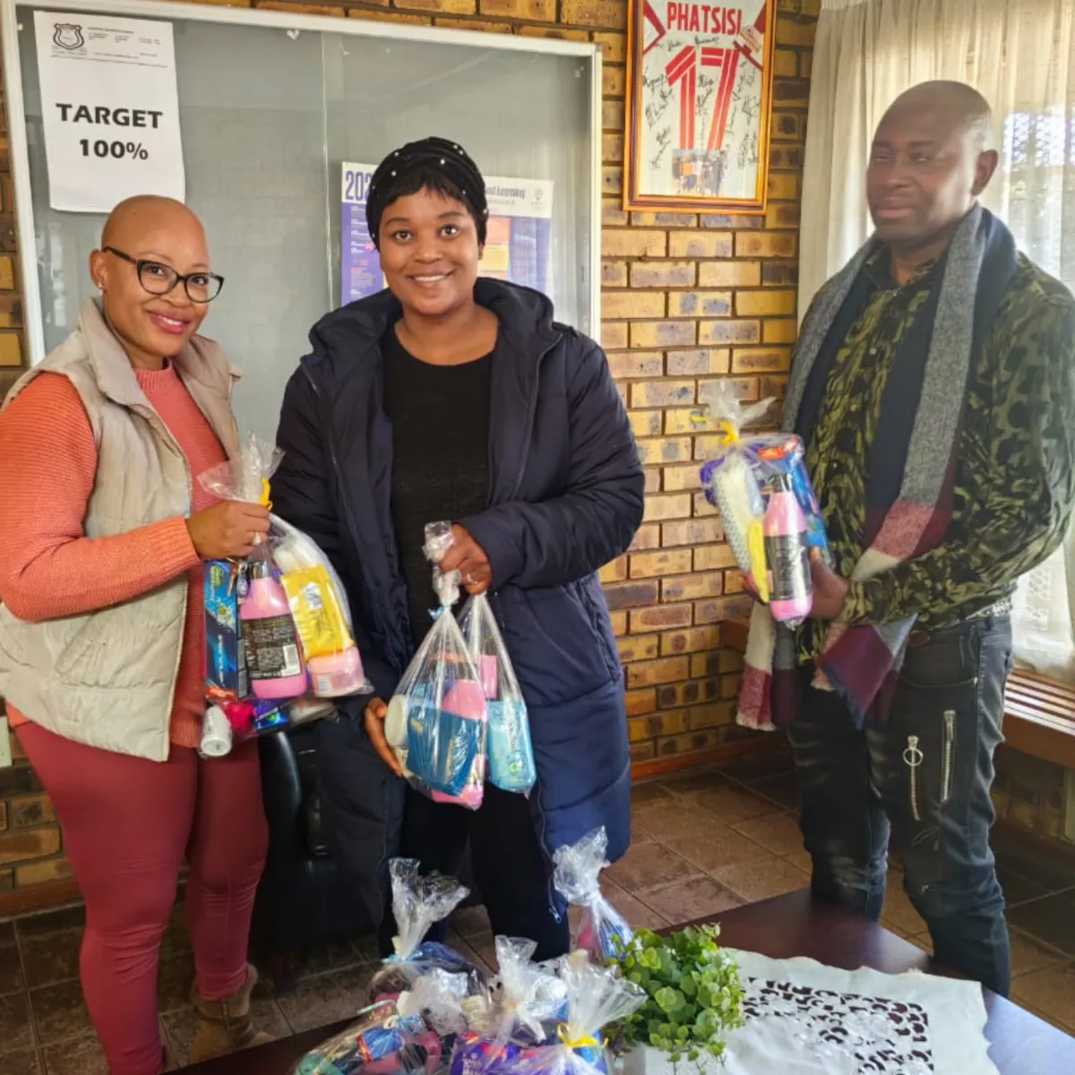 Noms Drive team working with community partners to distribute care packages in South Africa