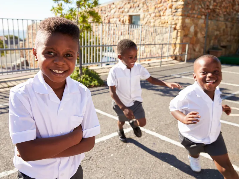 Children in school uniform supported by Noms Drive school shoes drive South Africa
