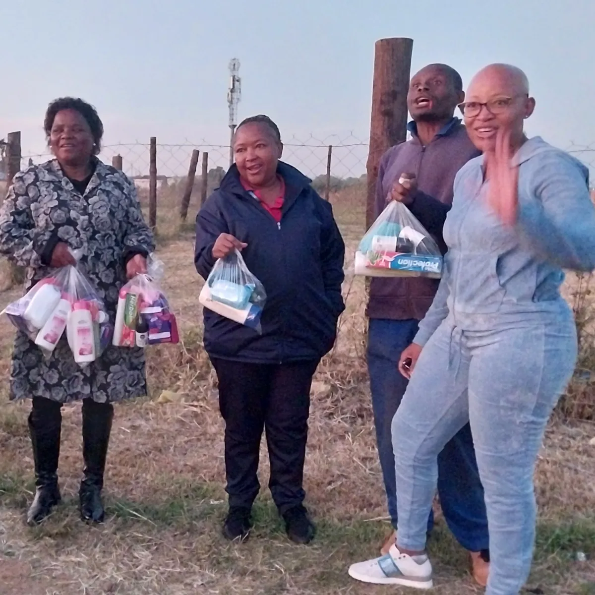 Noms Drive team engaging with community members during hygiene product distribution
